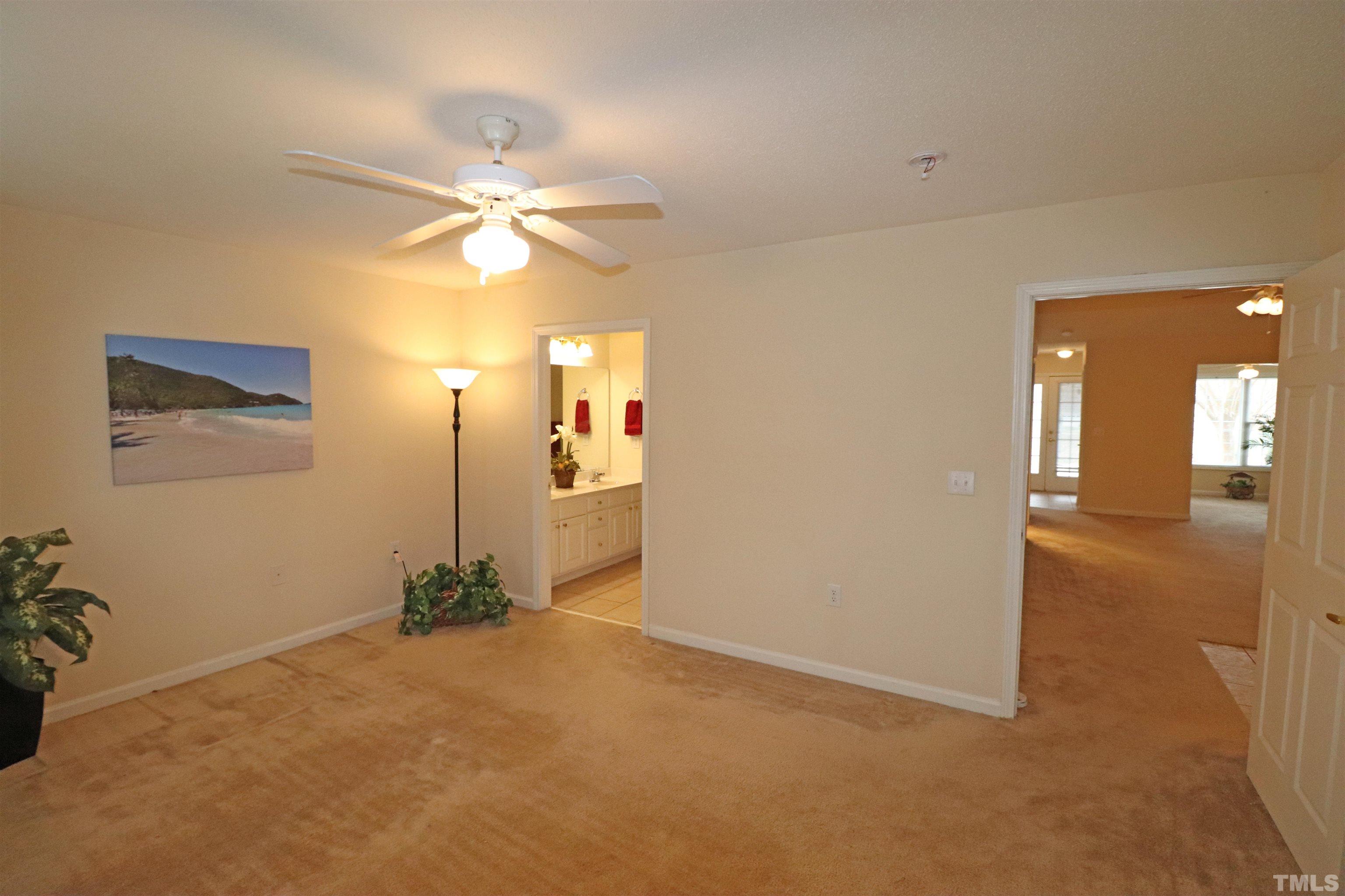 11301 Clubhaven Place, Unit 102 Raleigh, NC 27617 - Photo 35 of 53 an empty room with closet and a chandelier fan