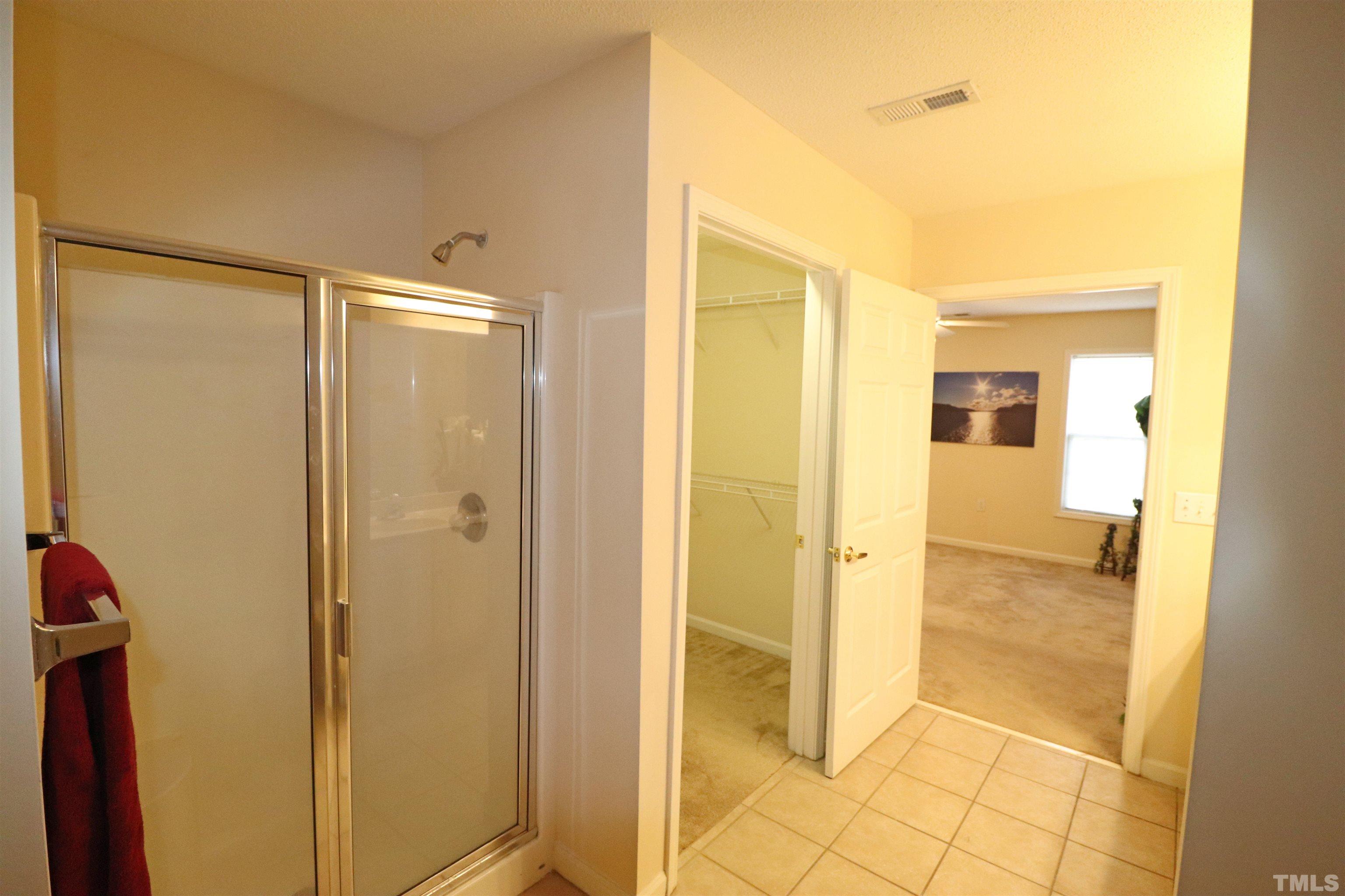 11301 Clubhaven Place, Unit 102 Raleigh, NC 27617 - Photo 42 of 53 a view of a bathroom with a glass door