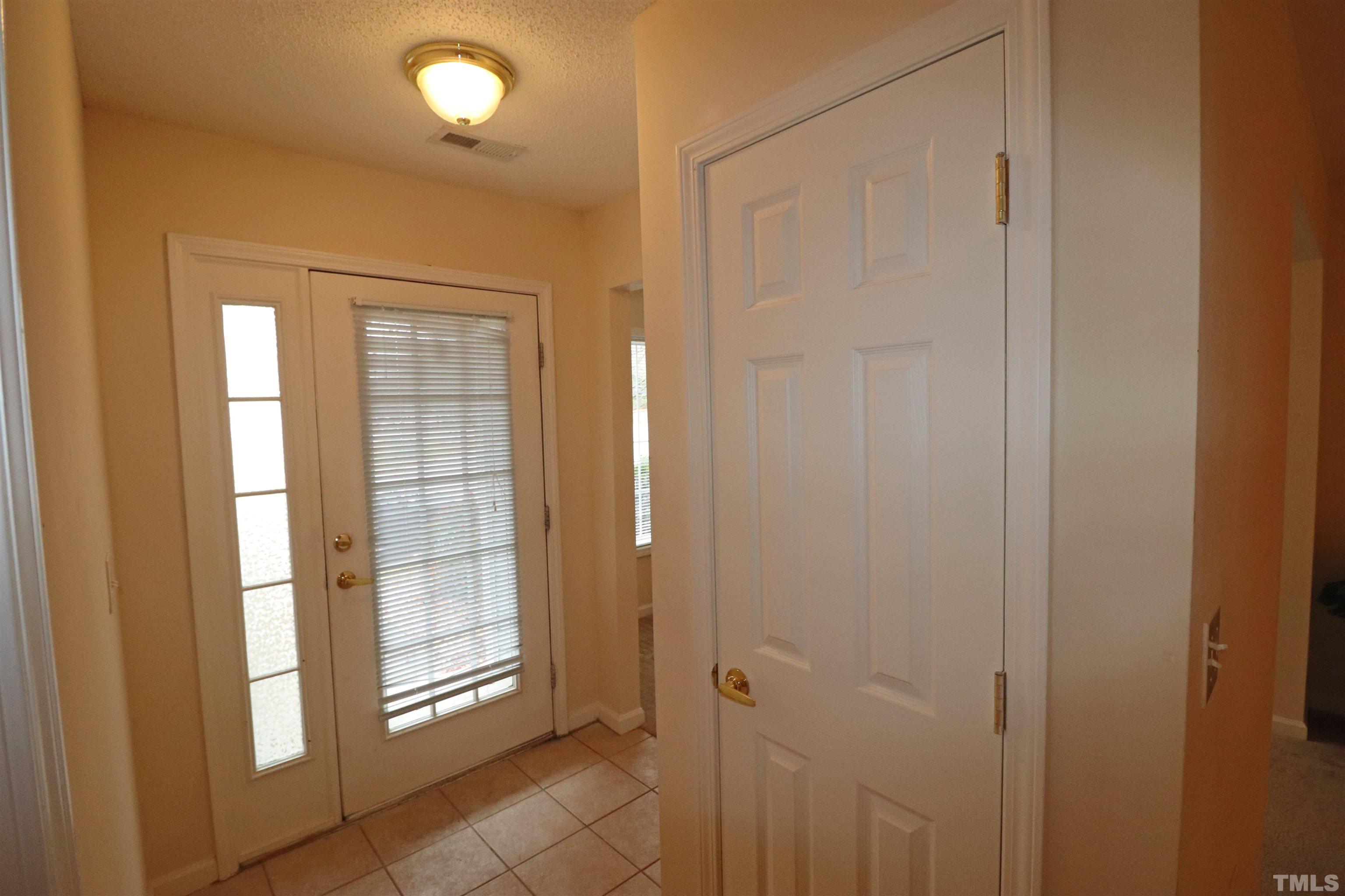11301 Clubhaven Place, Unit 102 Raleigh, NC 27617 - Photo 10 of 53 a view of a bathroom with sliding glass door and shower