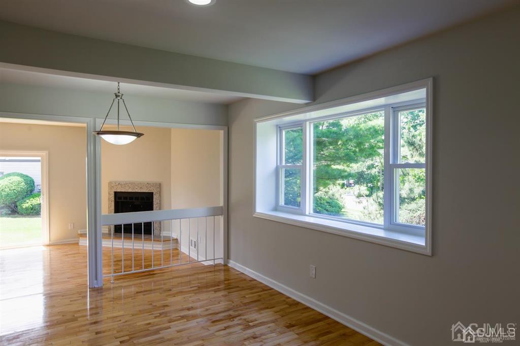 3304 Hana Road Edison, NJ 08817 - Photo 7 of 13 a view of a livingroom with wooden floor and a window