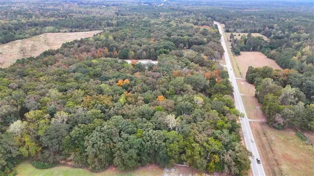 an aerial view of houses with yard