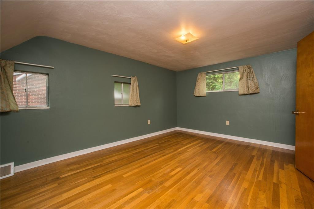 3816 West Run Road Homestead, PA 15120 - Photo 13 of 21 The bedroom offers views of the left-side and rear yards.