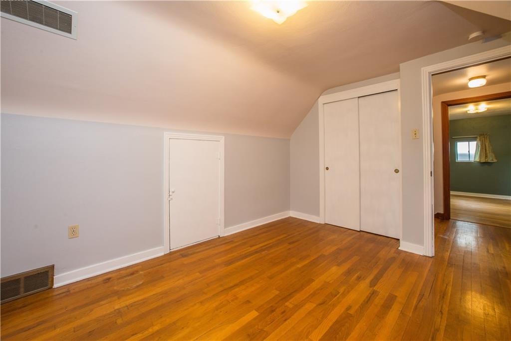 3816 West Run Road Homestead, PA 15120 - Photo 15 of 21 The third bedroom is directly across the hall from the second. It too has a double closet and hardwood flooring.