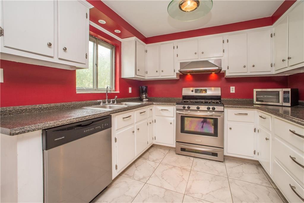 3816 West Run Road Homestead, PA 15120 - Photo 7 of 21 The updated kitchen offers newer countertops, double-bowl sink, stainless appliances, easy-care flooring, and under-cabinet lighting. The kitchen remodel kept efficiency in mind, and offers plentiful work and storage space.