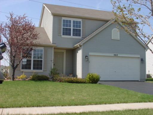 2012 Prairie Ridge Drive Plainfield, IL 60586 - Photo 1 of 1 a front view of house with a garden