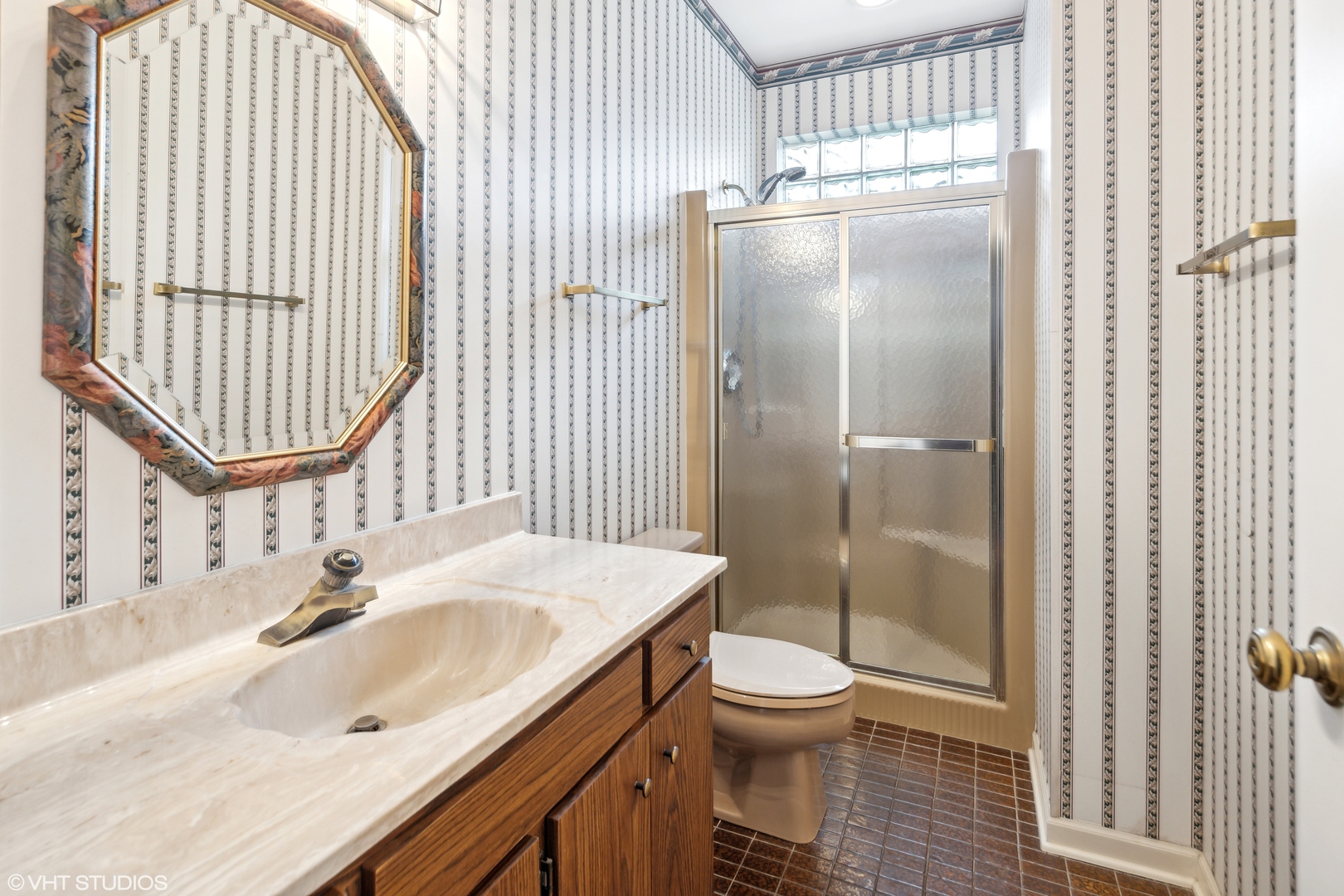 1050 South Ridge Road Lake Forest, IL 60045 - Photo 15 of 40 a bathroom with a sink toilet and shower