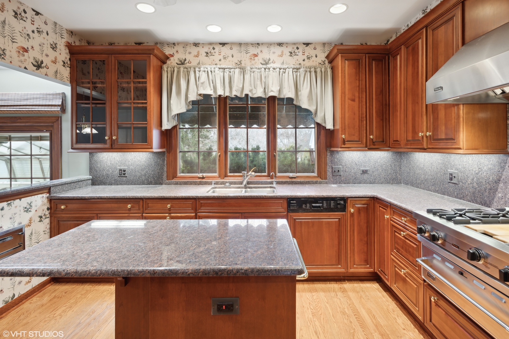 1050 South Ridge Road Lake Forest, IL 60045 - Photo 17 of 40 a kitchen with granite countertop a sink and a stove