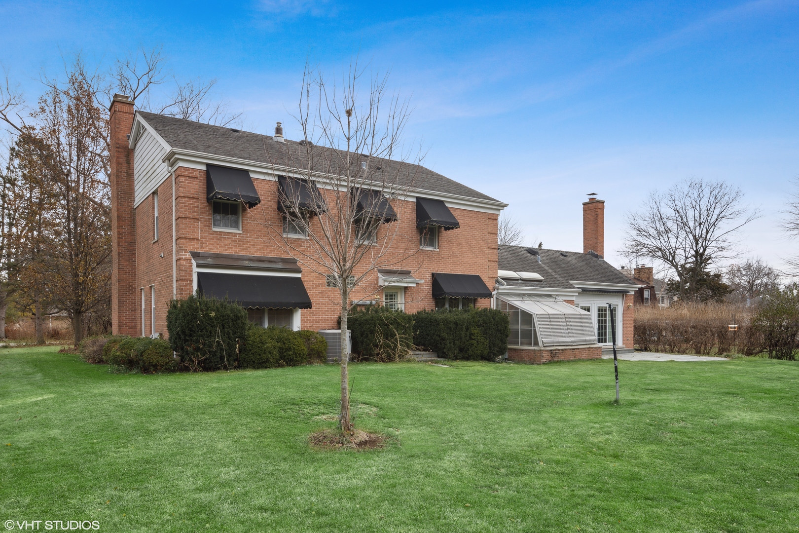 1050 South Ridge Road Lake Forest, IL 60045 - Photo 5 of 40 a front view of a house with a garden