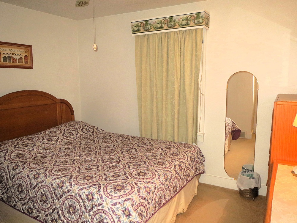 1027 Bluff Road Dixon, IL 61021 - Photo 11 of 48 a bedroom with a bed and a dresser