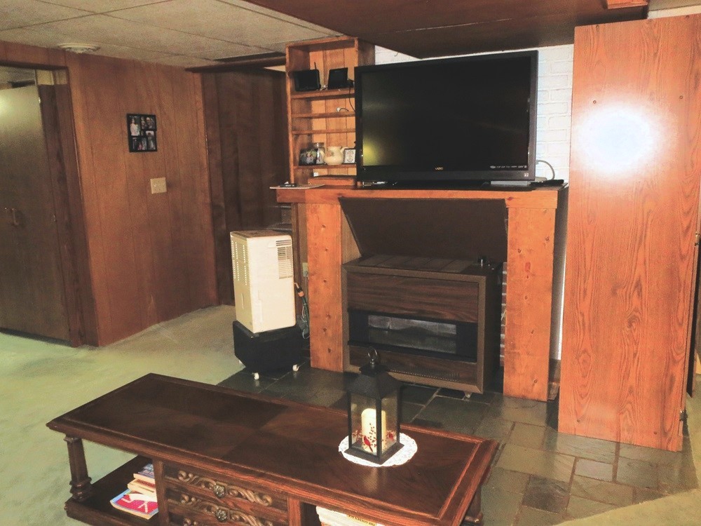 1027 Bluff Road Dixon, IL 61021 - Photo 19 of 48 a living room with furniture and a flat screen tv