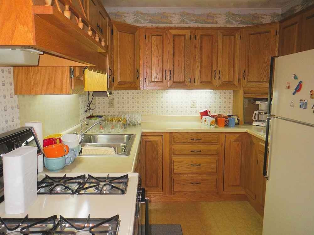 1027 Bluff Road Dixon, IL 61021 - Photo 31 of 48 a kitchen with a refrigerator and a stove