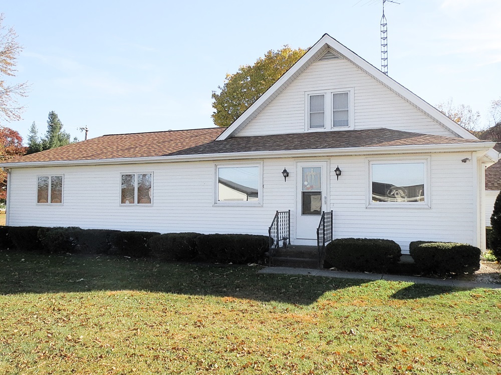1027 Bluff Road Dixon, IL 61021 - Photo 47 of 48 a view of a white house with swimming pool next to a yard