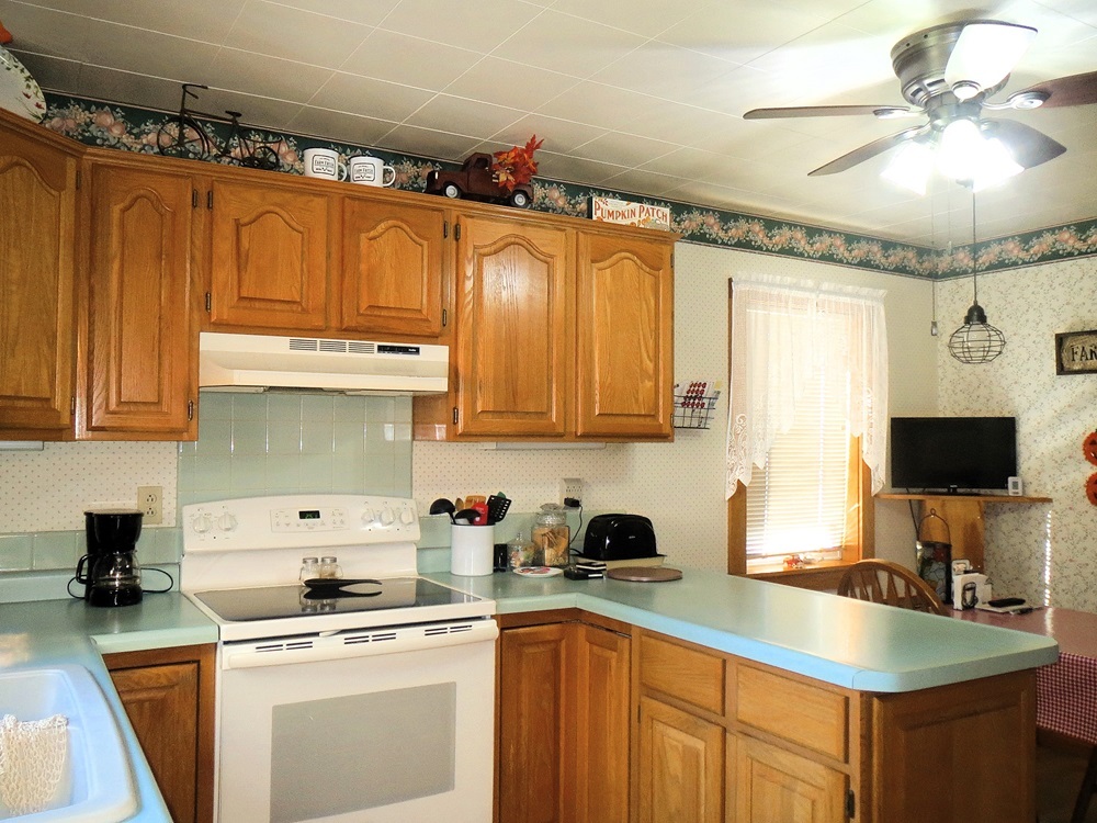 1027 Bluff Road Dixon, IL 61021 - Photo 8 of 48 a kitchen with stainless steel appliances granite countertop a sink stove and refrigerator