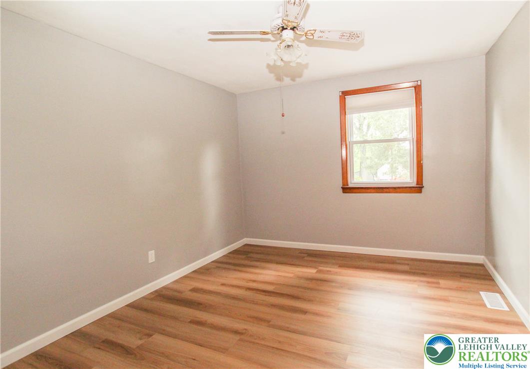 492 Filetown Road Nazareth, PA 18064 - Photo 14 of 30 A quiet bedroom with durable wood flooring and a single window, offering a peaceful retreat.