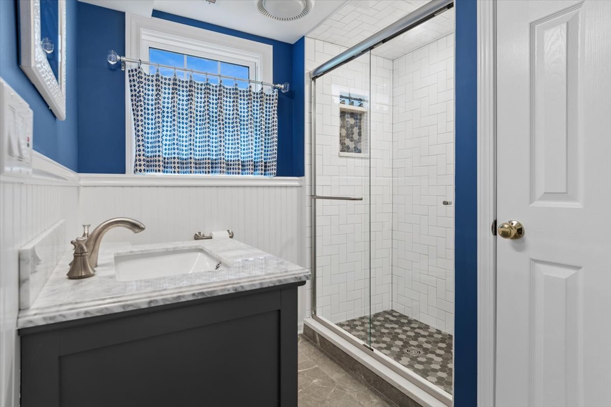 1232 Laurel Lane Naperville, IL 60540 - Photo 13 of 24 a bathroom with a sink and a mirror