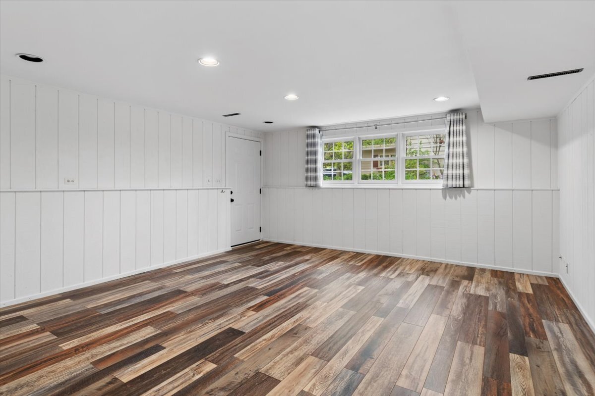 1232 Laurel Lane Naperville, IL 60540 - Photo 14 of 24 wooden floor in an empty room with a window
