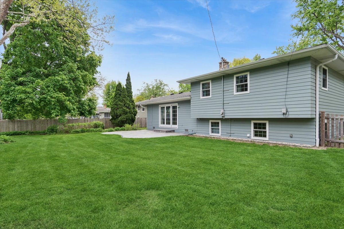 1232 Laurel Lane Naperville, IL 60540 - Photo 19 of 24 a front view of house with yard and green space