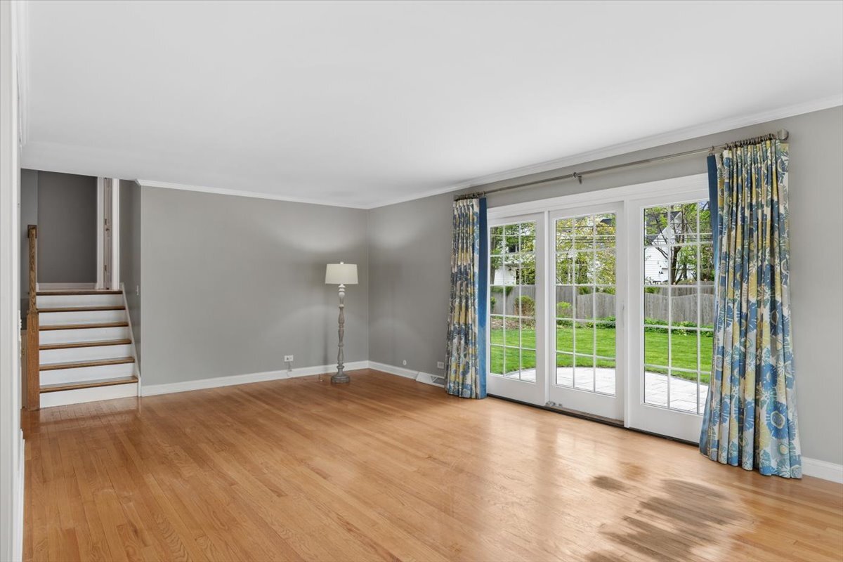 1232 Laurel Lane Naperville, IL 60540 - Photo 6 of 24 a view of a big room with wooden floor and windows