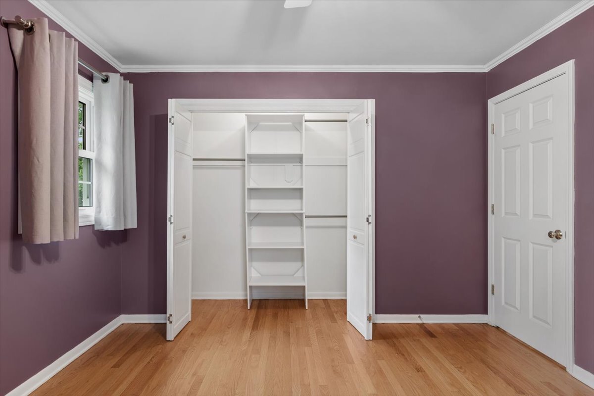 1232 Laurel Lane Naperville, IL 60540 - Photo 8 of 24 a view of an empty room with closet and wooden floor