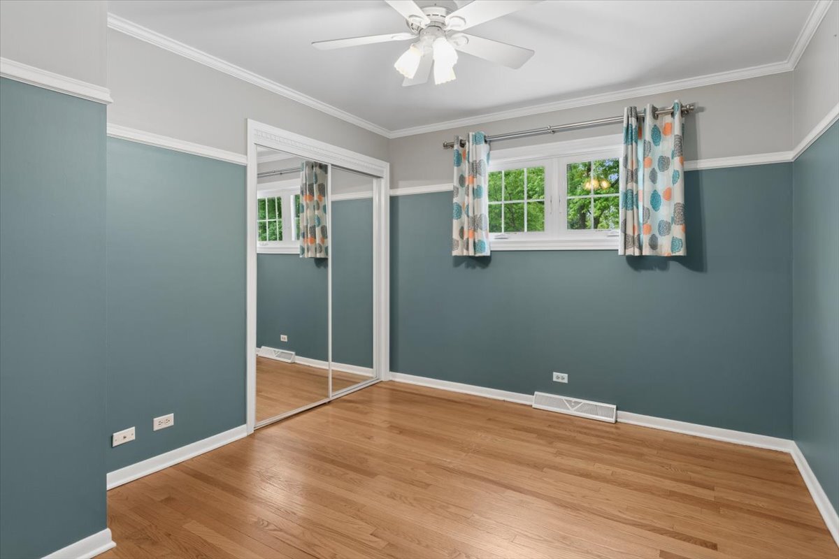 1232 Laurel Lane Naperville, IL 60540 - Photo 9 of 24 wooden floor in an empty room with a window