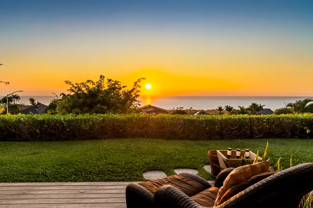a view of a couches with lounge chairs in the patio