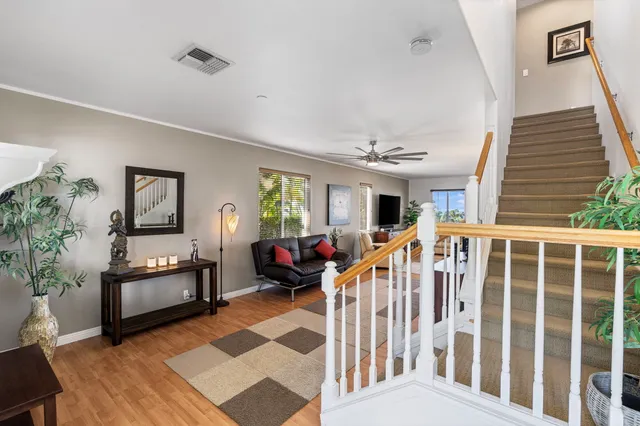 a living room with furniture and a rug
