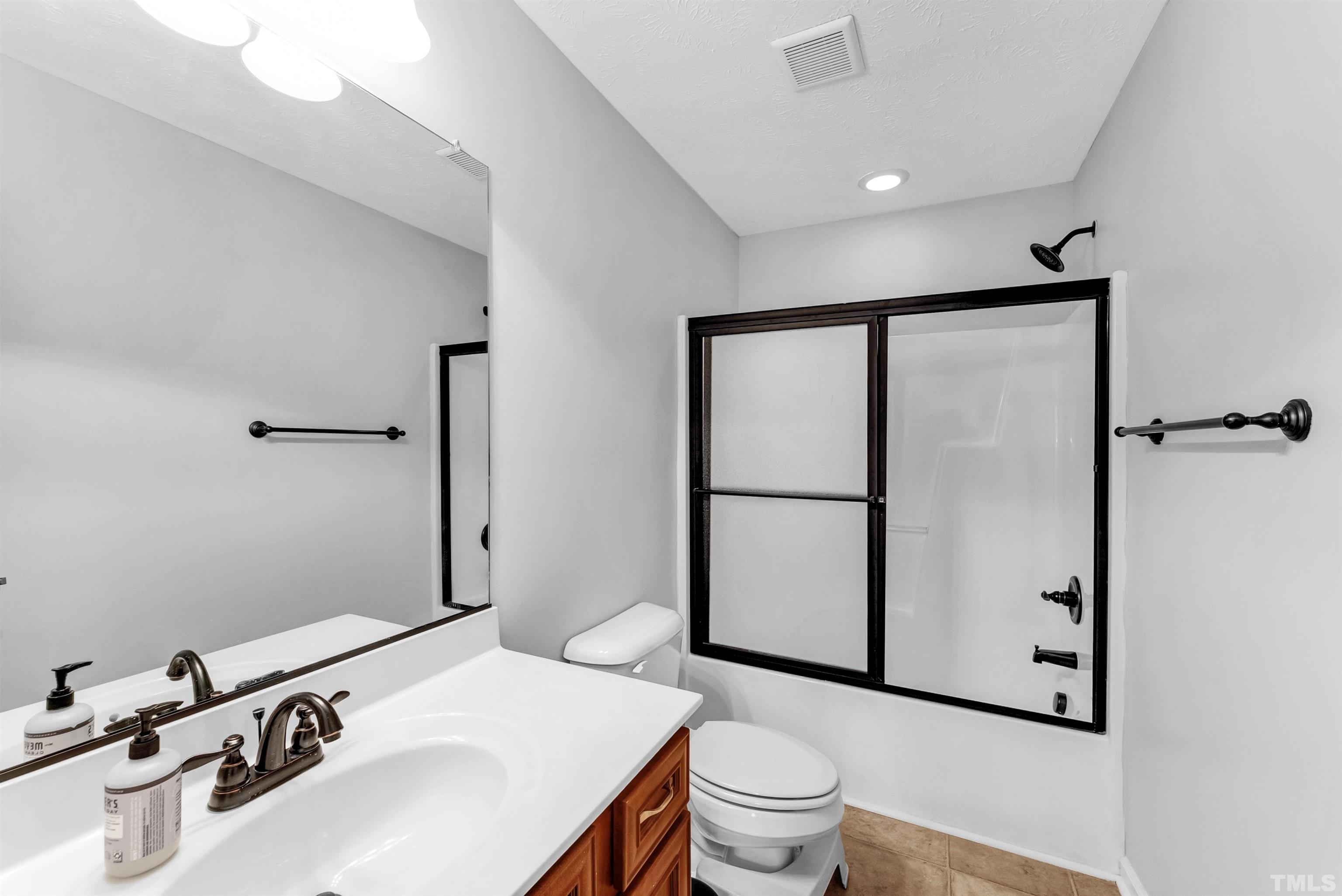 707 Botanical Court Bunnlevel, NC 28323 - Photo 20 of 31 a bathroom with a sink toilet and shower