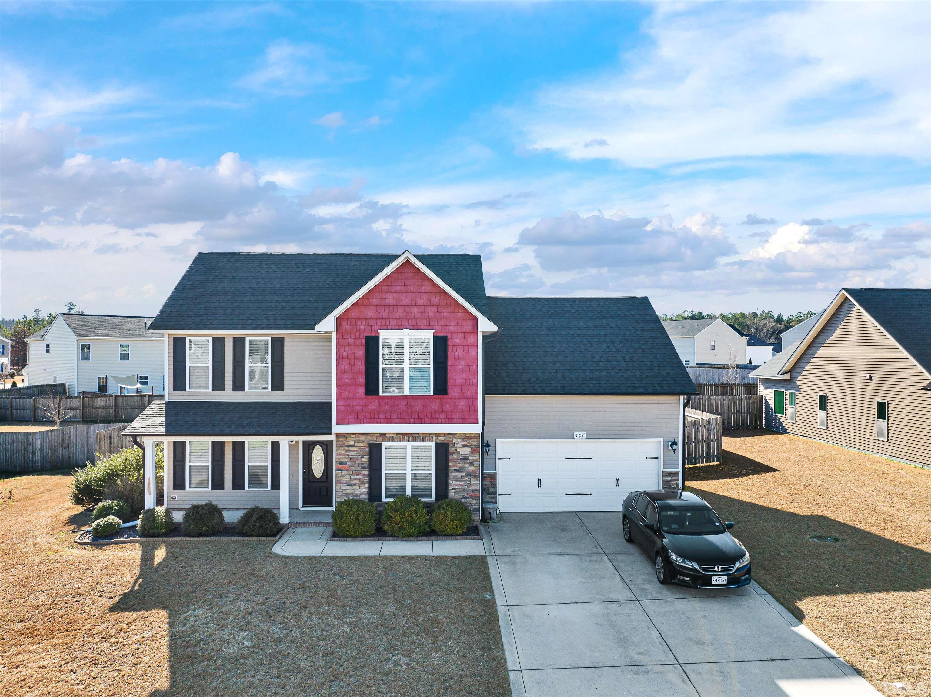 707 Botanical Court Bunnlevel, NC 28323 - Photo 2 of 31 a front view of a house with a yard