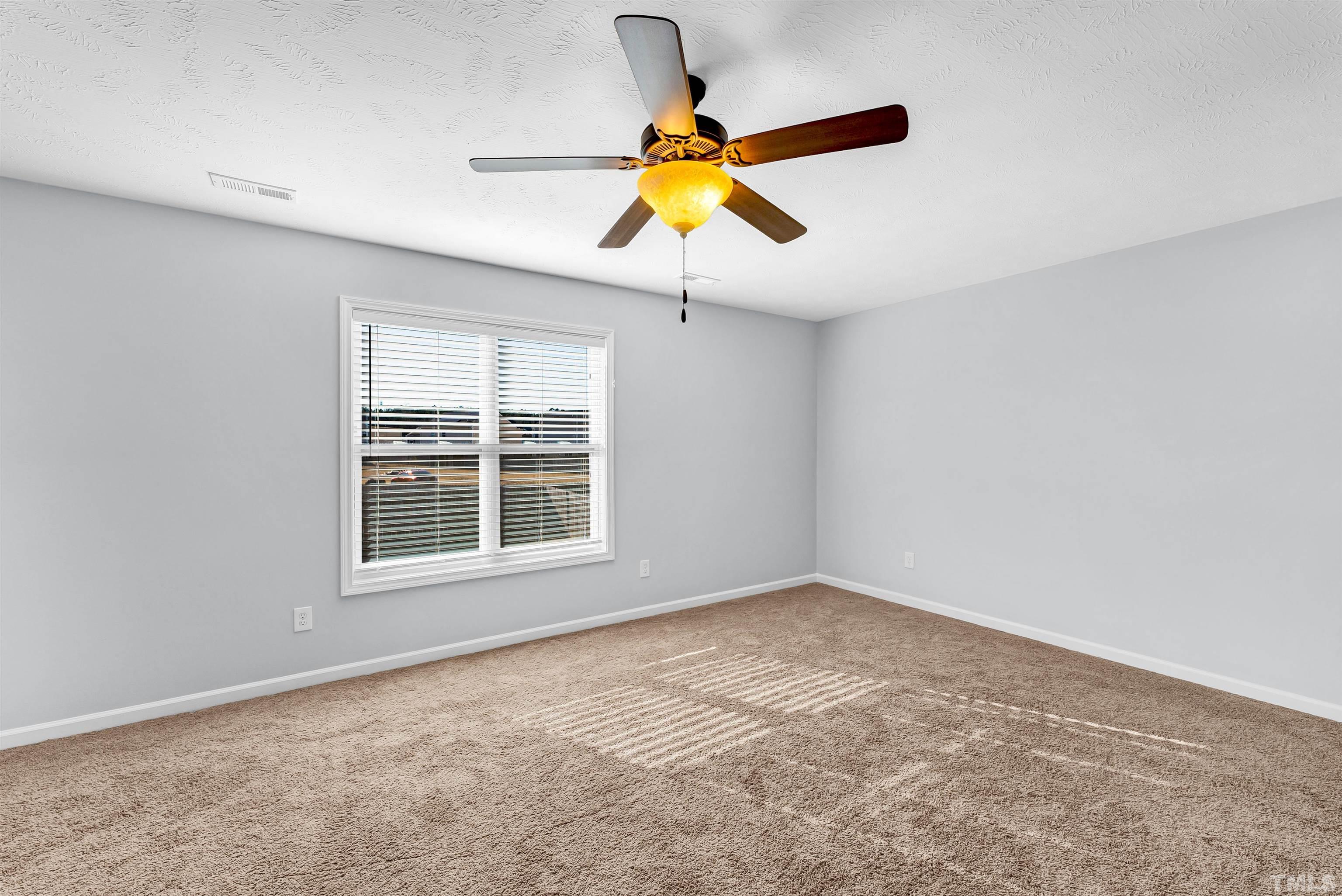 707 Botanical Court Bunnlevel, NC 28323 - Photo 21 of 31 a view of an empty room with a window