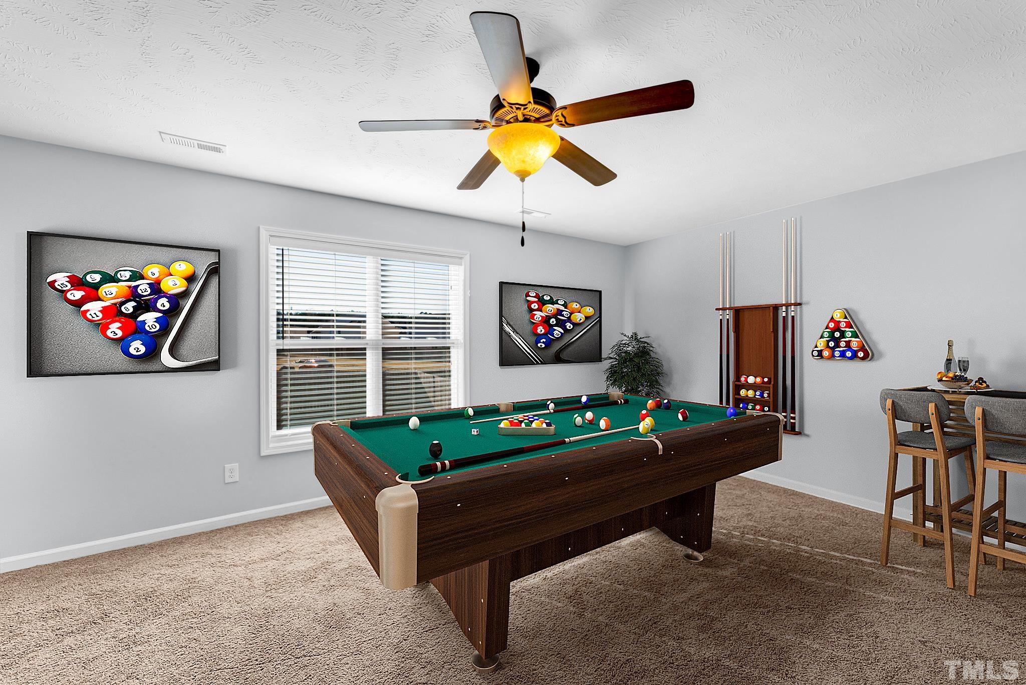 707 Botanical Court Bunnlevel, NC 28323 - Photo 22 of 31 a living room with furniture and a flat screen tv