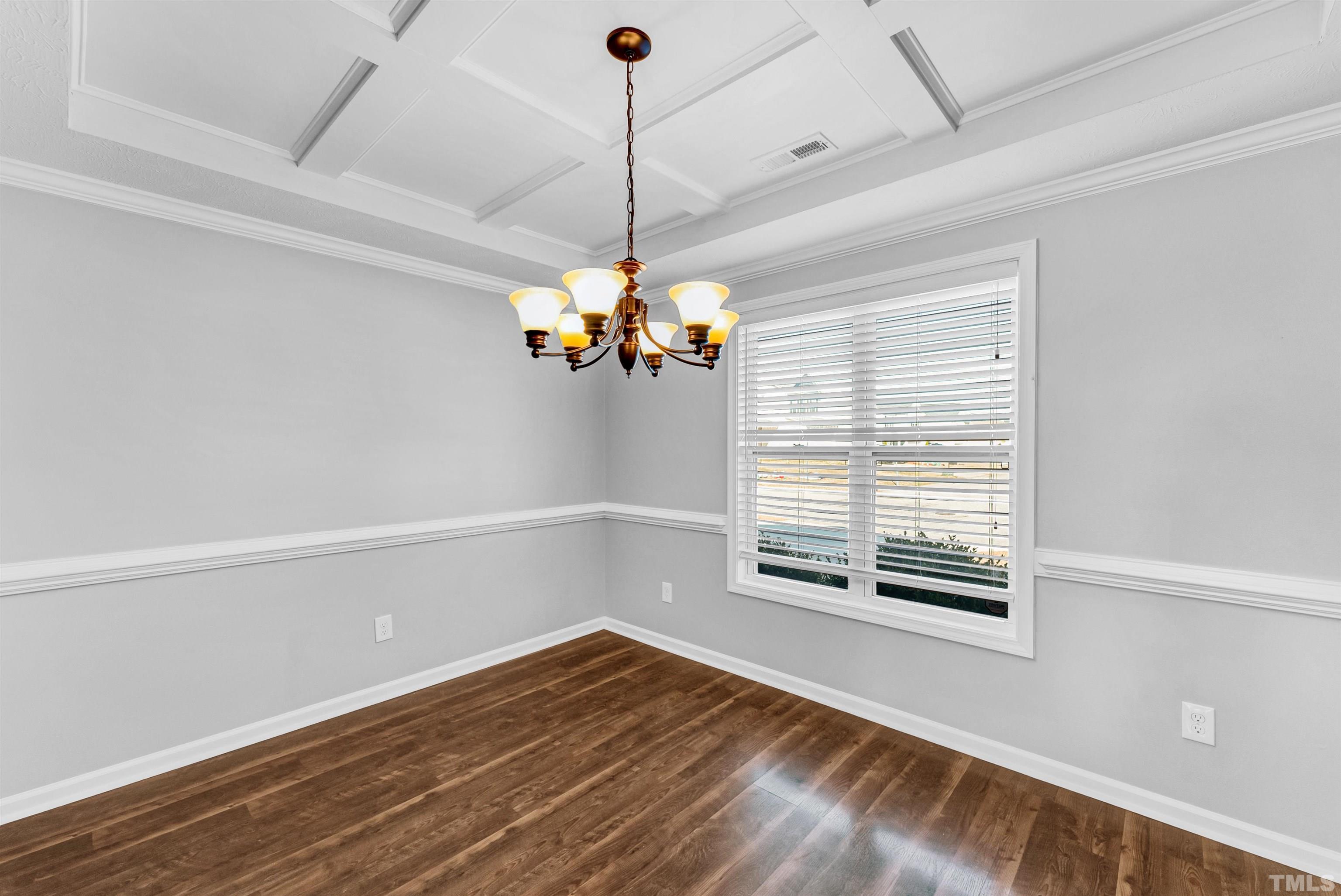 707 Botanical Court Bunnlevel, NC 28323 - Photo 8 of 31 a view of a room with a window and wooden floor