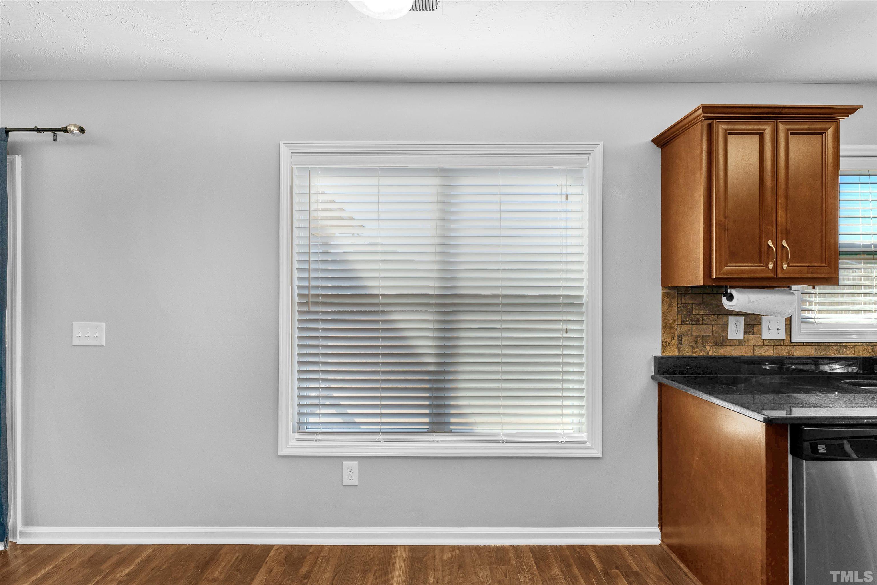 707 Botanical Court Bunnlevel, NC 28323 - Photo 10 of 31 a view of a kitchen that shows a sink and a window