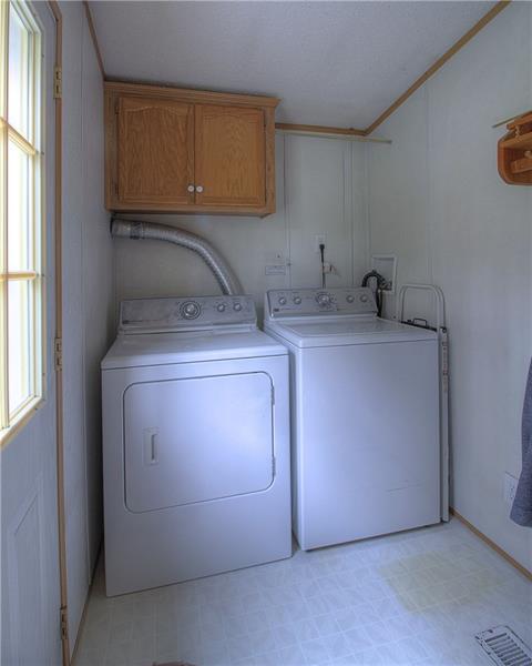 388 Rohrmann Road Darlington, PA 16115 - Photo 21 of 25 First floor laundry room. Man door leads to side deck/lower patio.