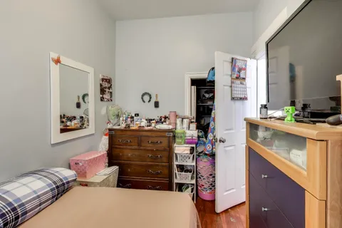 a bedroom with a bed and furniture