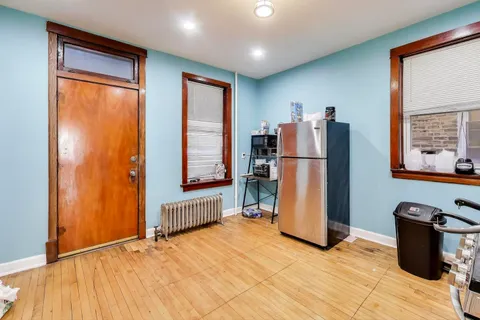a view of a livingroom with furniture and a window
