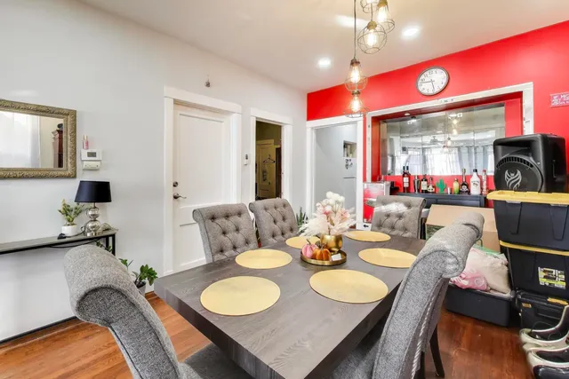 a view of a dining room with furniture and wooden floor