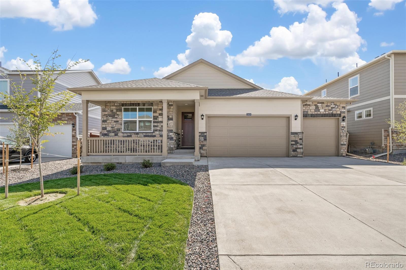 950 London Way Severance, CO 80550 - Photo 1 of 21 a front view of a house with a yard and garage