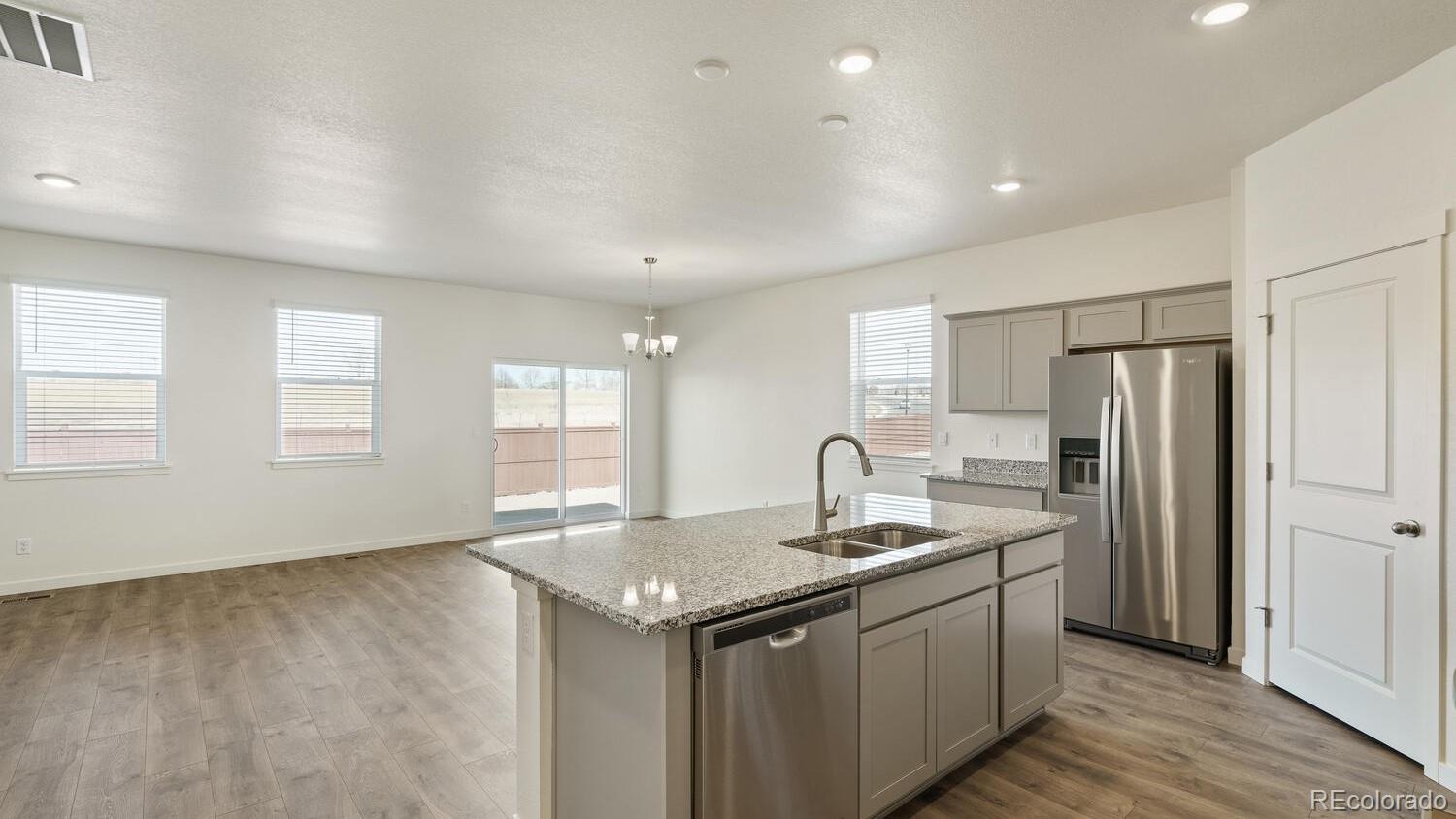 950 London Way Severance, CO 80550 - Photo 14 of 21 a kitchen with a sink stove and refrigerator