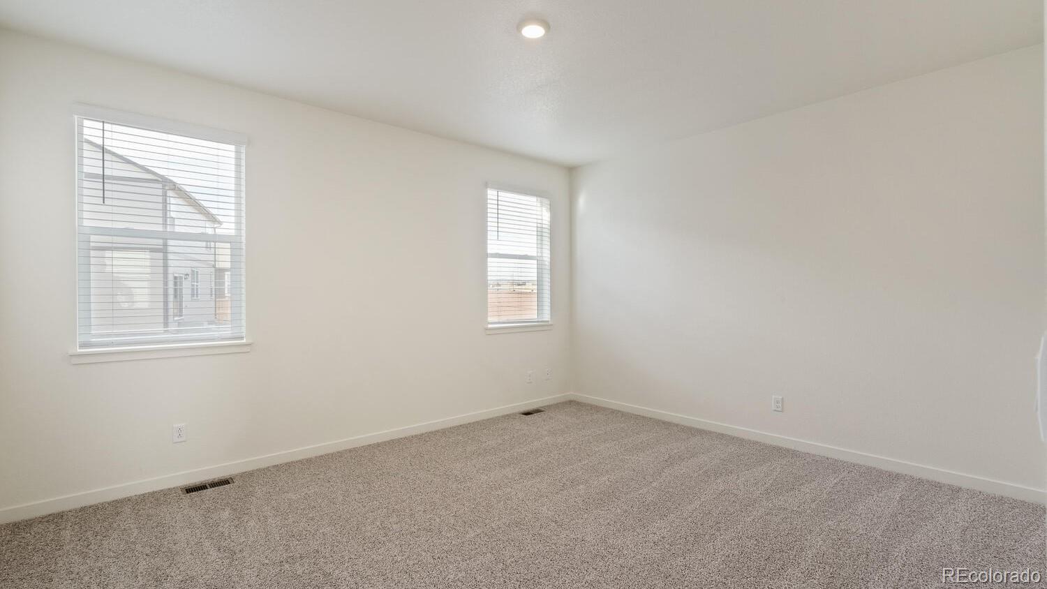 950 London Way Severance, CO 80550 - Photo 16 of 21 an empty room with windows