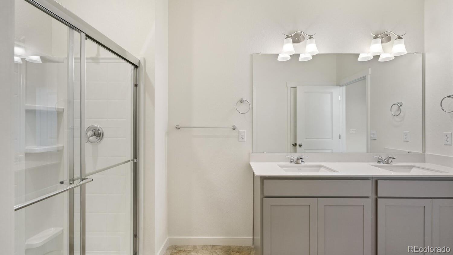 950 London Way Severance, CO 80550 - Photo 18 of 21 a bathroom with a sink vanity and a mirror