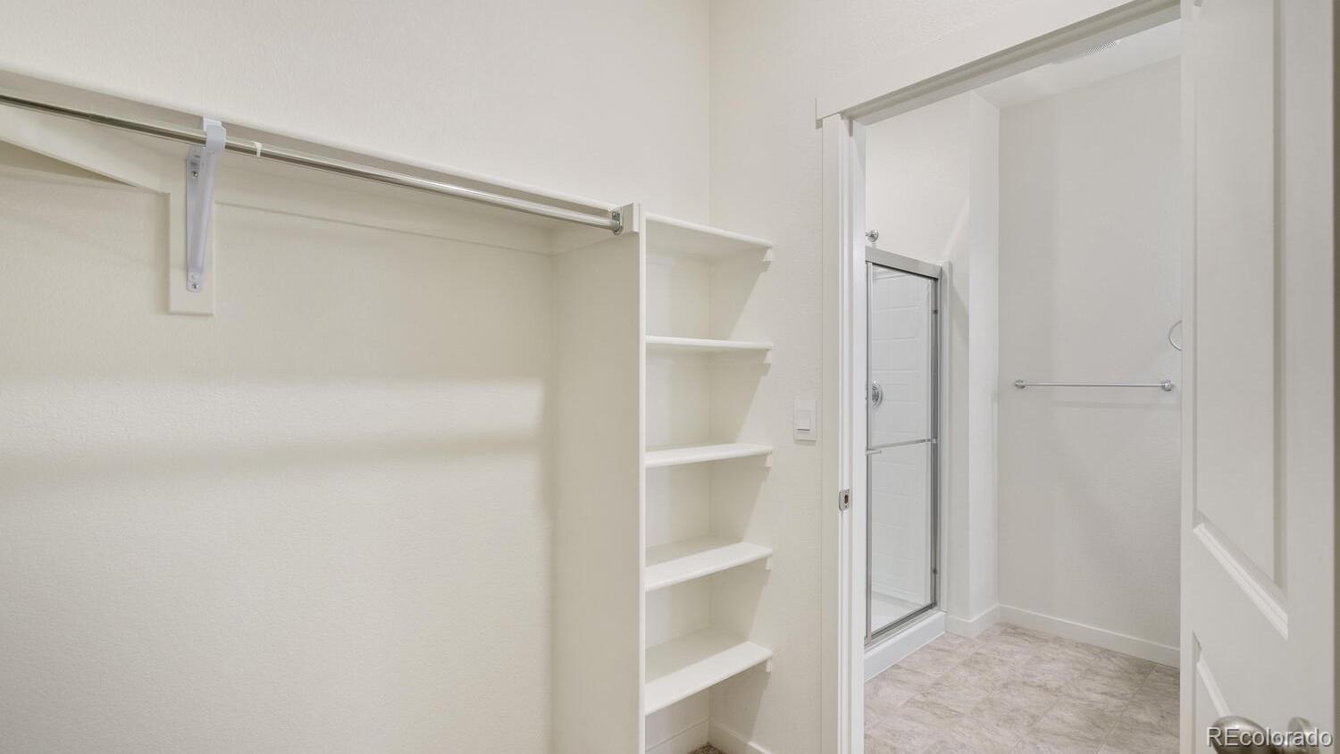 950 London Way Severance, CO 80550 - Photo 19 of 21 a view of an empty walk in closet