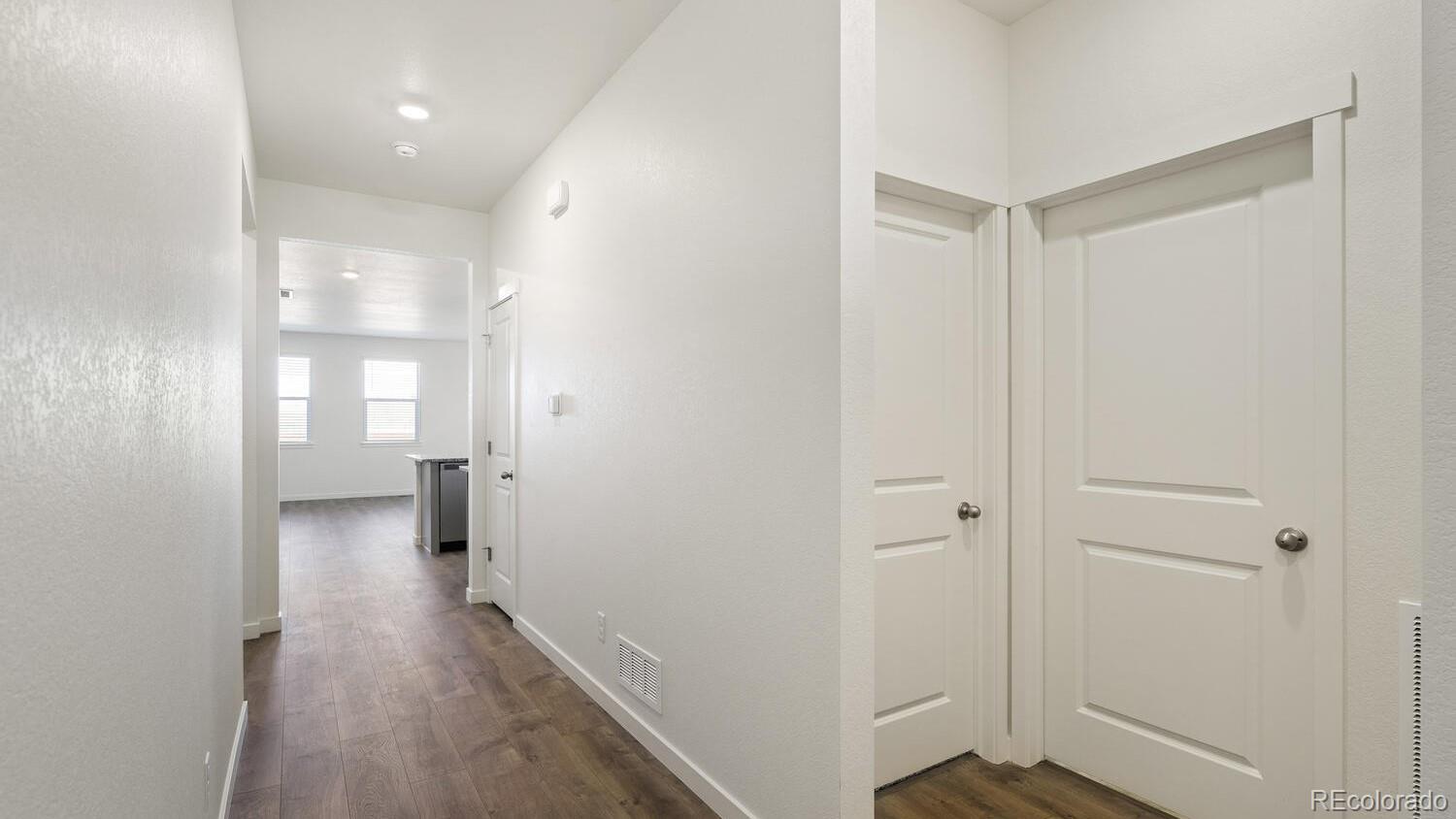 950 London Way Severance, CO 80550 - Photo 7 of 21 a view of a hallway with wooden floor