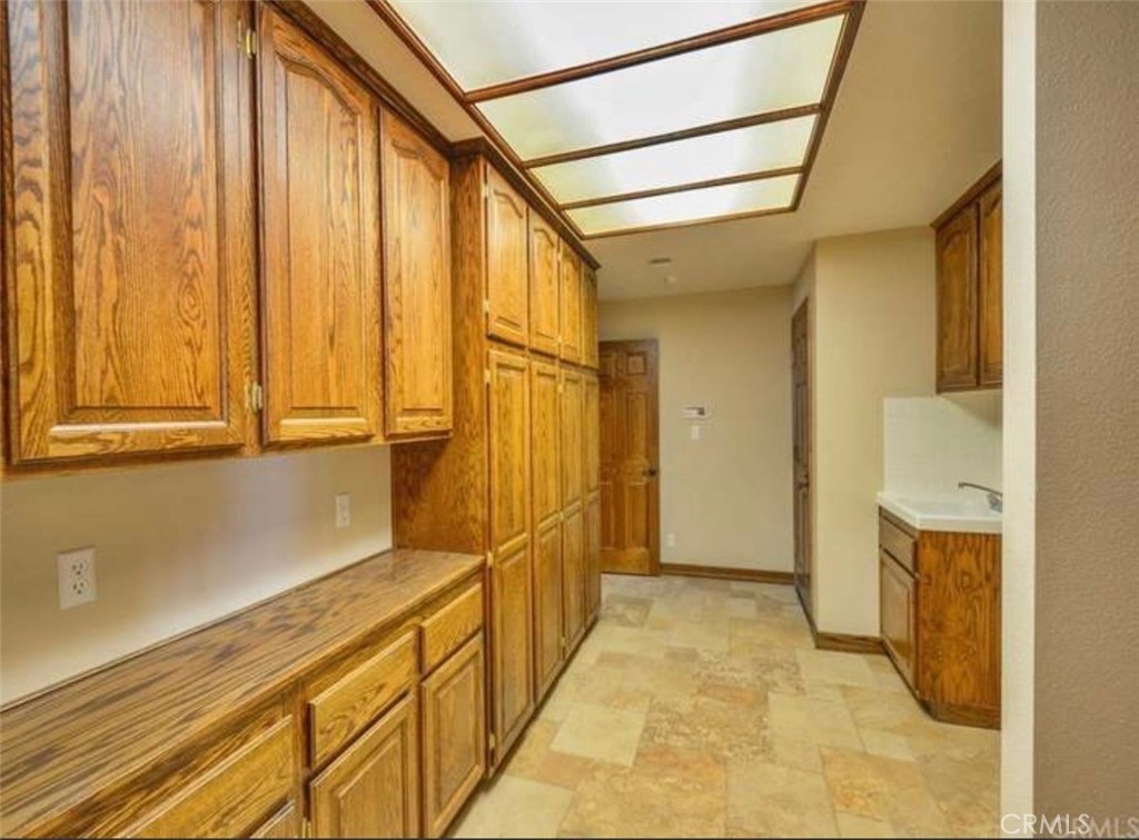 9126 Kittering Road Oak Hills, CA 92344 - Photo 31 of 47 indoor laundry room