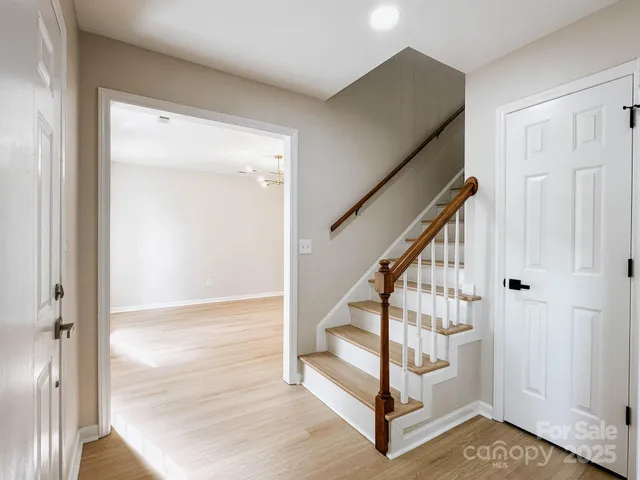 a view of entryway with wooden floor