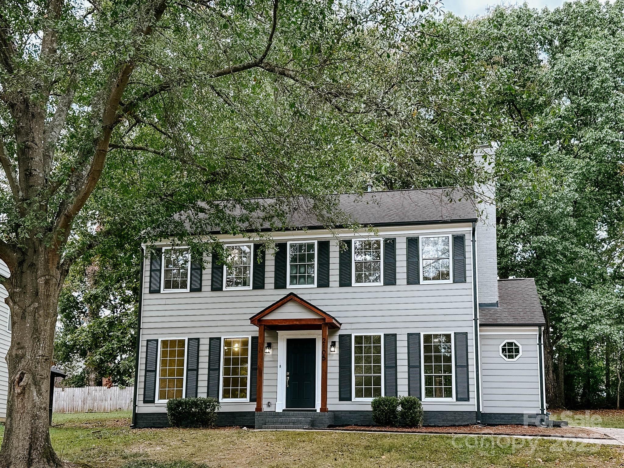 2105 Killarney Place Charlotte, NC 28262 - Photo 2 of 43 a front view of a house with a yard