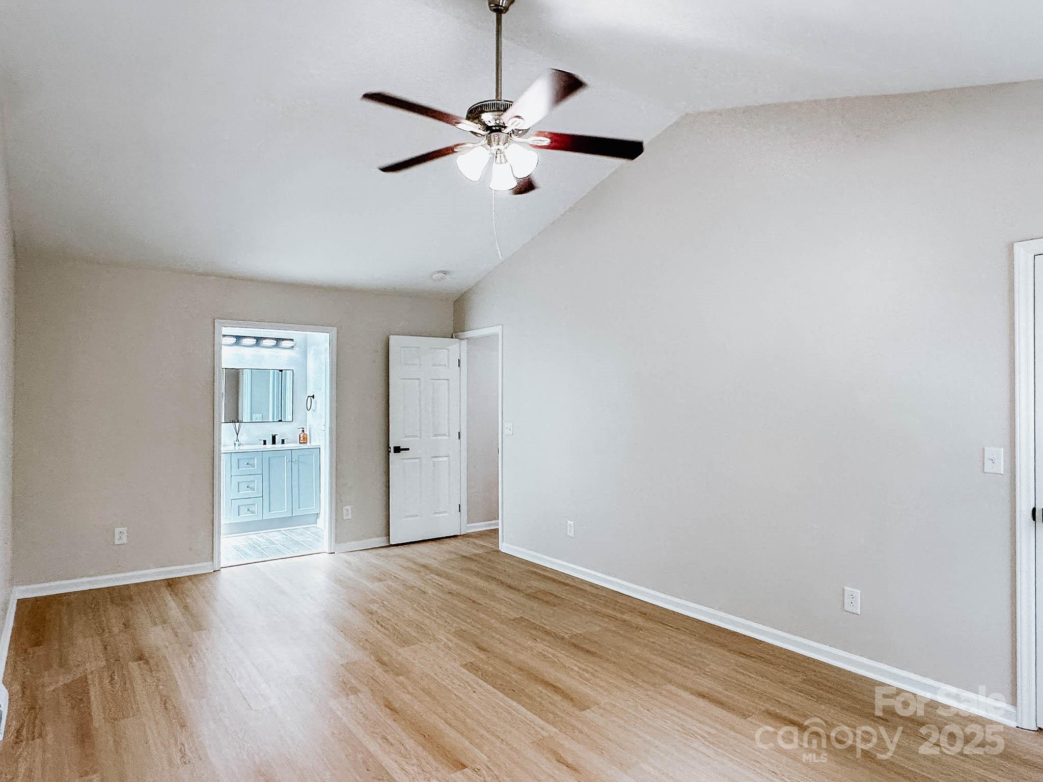 2105 Killarney Place Charlotte, NC 28262 - Photo 21 of 43 a view of an empty room with wooden floor