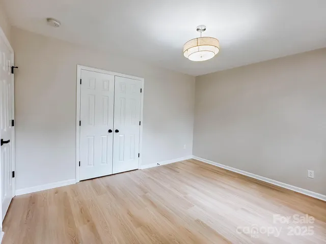 a view of an empty room and a window