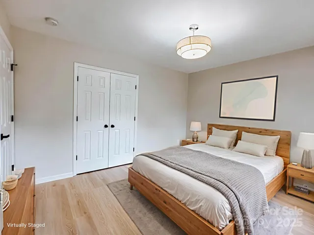 a bedroom with bed and a window