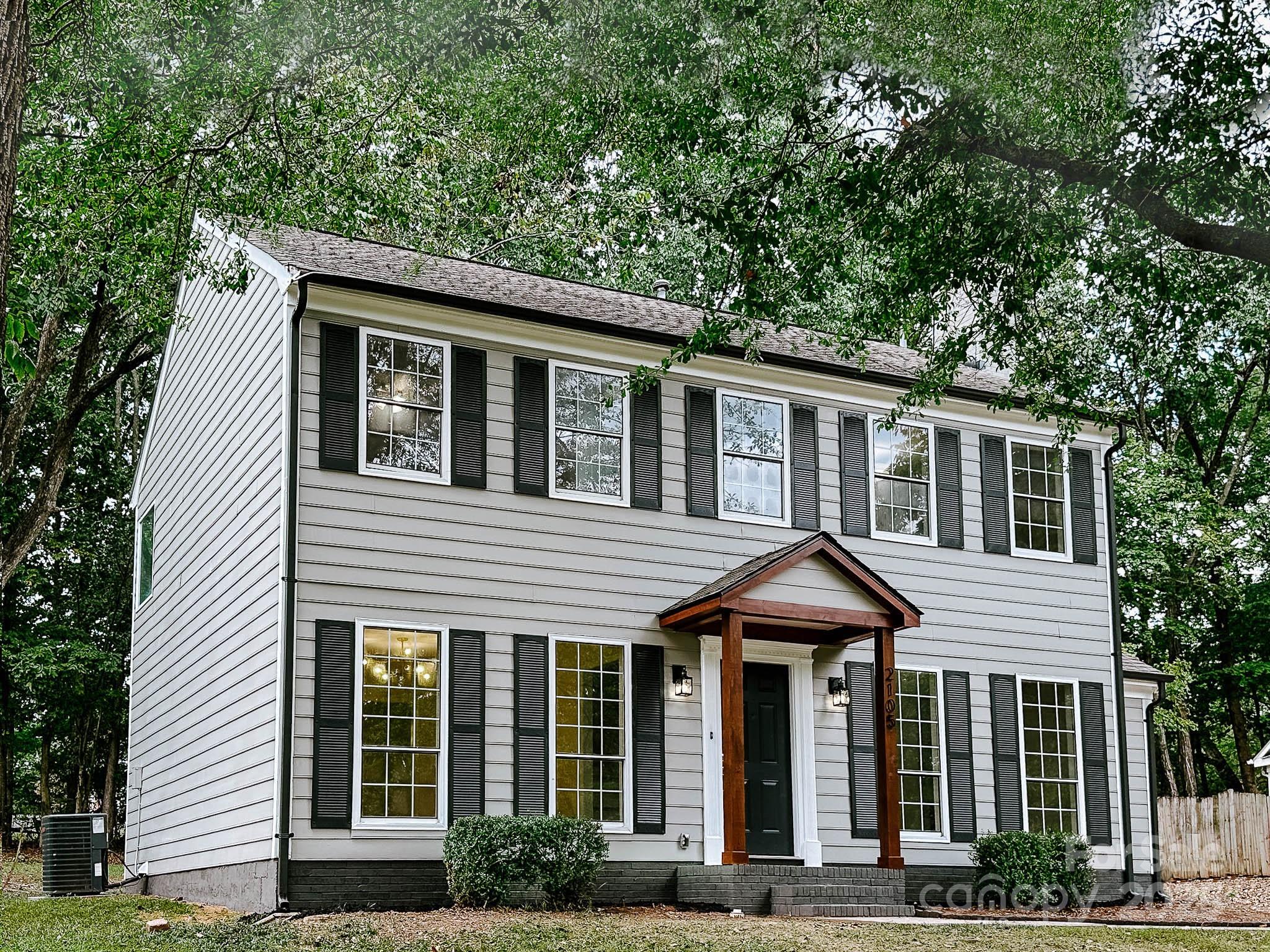 2105 Killarney Place Charlotte, NC 28262 - Photo 35 of 43 a front view of a house with garden