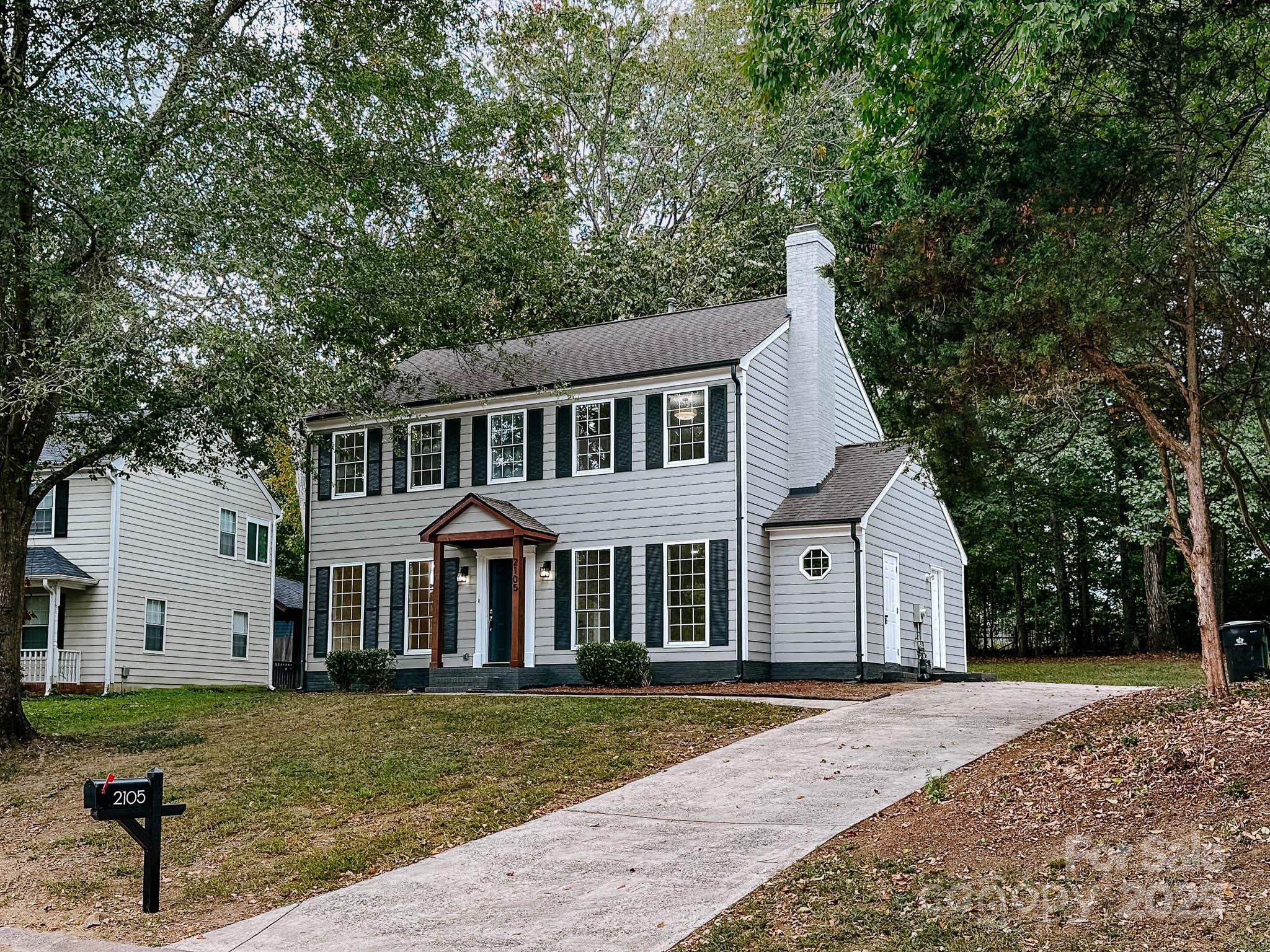 2105 Killarney Place Charlotte, NC 28262 - Photo 36 of 43 a front view of a house with a yard